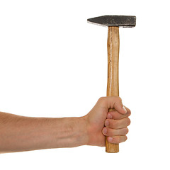 Image showing Man holding a old wooden hammer