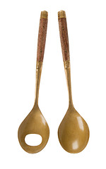 Image showing Old brass serving spoons isolated