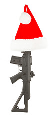 Image showing Weapon (firearm) concealed in santas hat