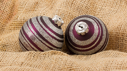 Image showing Two purple Christmas balls isolated