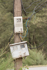 Image showing Cabinet with electrical meter on a concrete pole