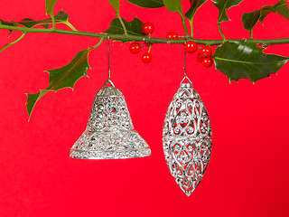 Image showing Old silver bells hanging in Butcher's broom