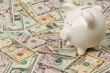 Image showing Piggy bank on dollar bills