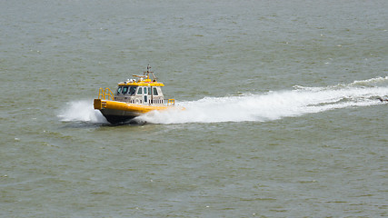 Image showing Yellow Crewtender at high speed