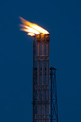 Image showing Burning oil gas flare during the night 