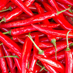 Image showing Heap Of Ripe Big Red Peppers At A Street Market In Dong Hoi