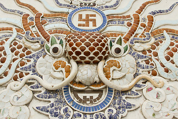 Image showing Chinese dragon ornament on a rooftop