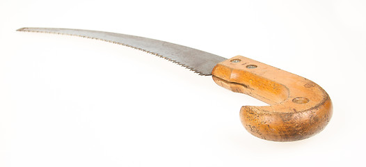 Image showing Old rusty toy hand saw on white