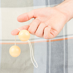 Image showing Hand holding vaginal balls, isolated