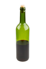 Image showing Half empty red wine bottle 