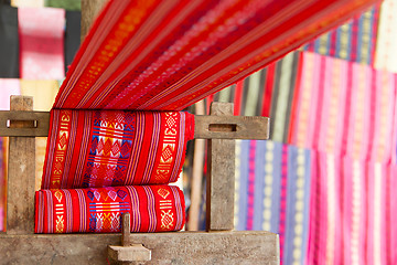 Image showing Handmade silk textile industry, silk scarf on a old machine