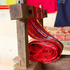 Image showing Handmade silk textile industry, silk scarf on a old machine