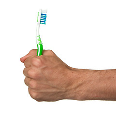 Image showing Man holding a green toothbrush