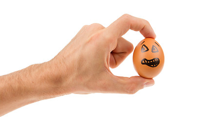 Image showing Scared egg, waiting to be grabbed by a hand