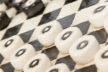 Image showing Very old game of checkers, pottery