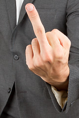 Image showing Business man making a rude hand gesture