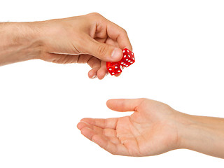 Image showing Two red dice being given