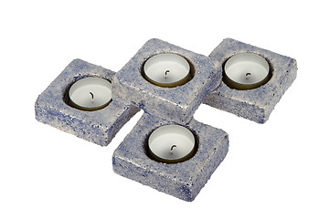 Image showing Candle-holder (pottery) or candlestick with four candles isolate