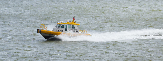 Image showing Yellow Crewtender at high speed