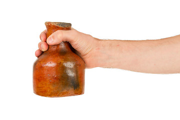 Image showing Man holding old earthen bowl