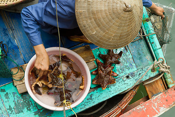 Image showing HA LONG BAY, VIETNAM AUG 10, 2012 - Food seller in boat. Many Vi