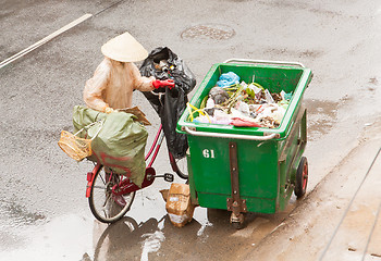 Image showing DA LAT, VIETNAM - 28 JULY 2012: Government worker separates the 