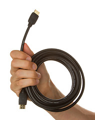 Image showing Man holding a black hdmi cable