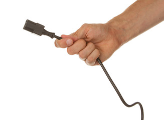 Image showing Man is holding a black outlet in the hand isolated