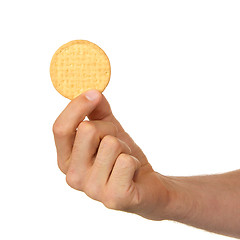 Image showing Man with a biscuit in his hand