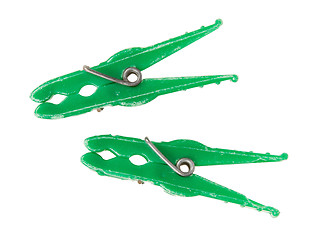 Image showing Two old green clothespins 