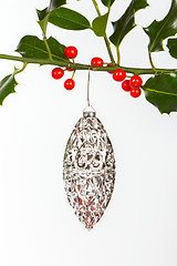 Image showing Very old silver christmas ball hanging from a twig (butchers bro