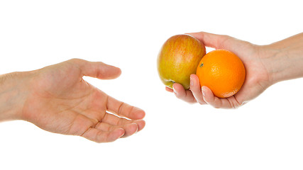 Image showing Giving an apple and an orange