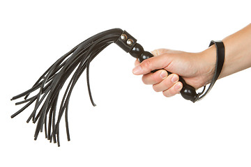Image showing Strict Black Leather Flogging Whip in woman's hand