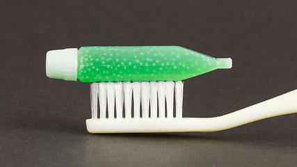 Image showing Toothbrush and green toothpaste isolated