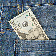 Image showing Macro shot of trendy jeans with american 20 dollar bill