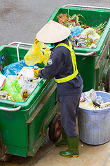 Image showing DA LAT, VIETNAM - 28 JULY 2012: Government worker separates the 