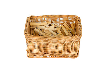 Image showing Basket with wooden clothespins