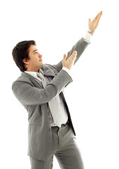 Image showing businessman showing imaginary product #2