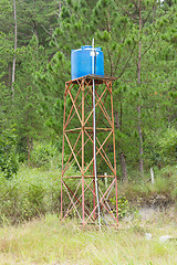 Image showing Primitive blue water tower 