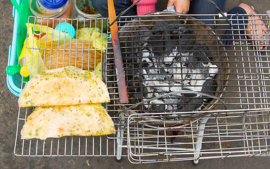 Image showing Rice paper meal being made on a barbeque