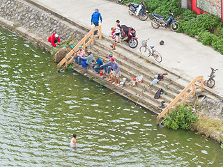 Image showing DONG HOI, VIETNAM - AUGUST 7, 2012. Unidentified people are fish