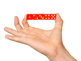 Image showing Man holding five red dice