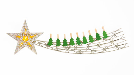 Image showing Falling star, christmas decoration with small clothing pins isol