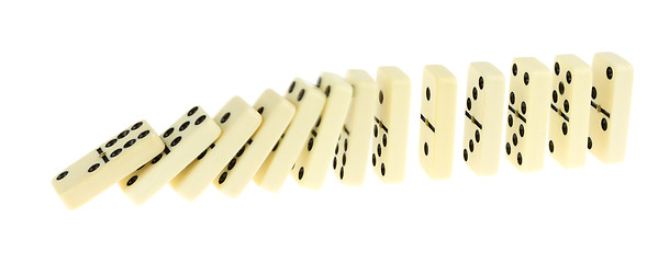 Image showing Long train of dominoes falling over