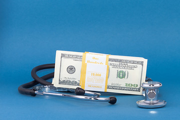 Image showing stethoscope and dollars