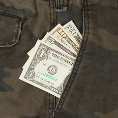 Image showing Macro shot of trendy jeans with american four different dollar b