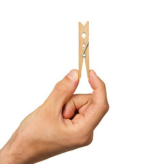Image showing Hand holding clothes peg