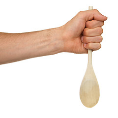 Image showing Man holding a wooden spoon