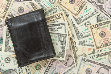 Image showing Old used wallet with dollars 