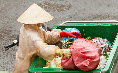 Image showing DA LAT, VIETNAM - 28 JULY 2012: Government worker separates the 